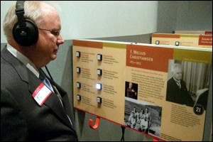 Bob Johnson listens to St. Olaf F. Melius Christiansen's listening exhibit at the MN 150 celebration.