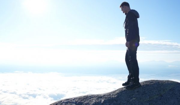 Photo of new Japanese professor Andrew Nelson on mountain top
