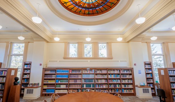 The main level sitting area of the Hong Kierkegaard Library, with bookshelves in the background, and the skylight visible on the ceiling.