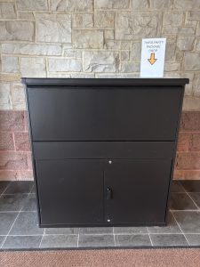 photo of a large black metal parcel drop box
