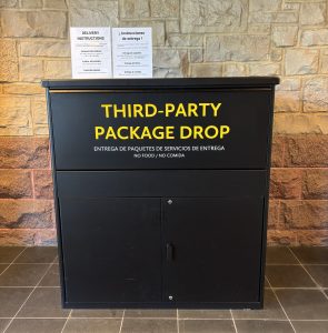 photo of a large black metal parcel drop box