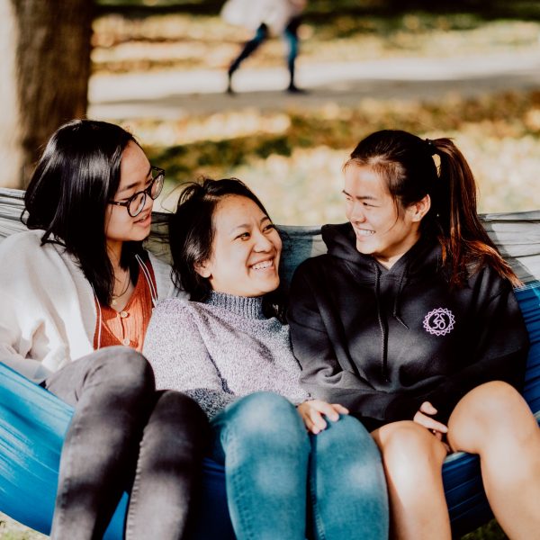Three students in a hammock