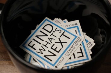 Stickers with Piper Center's slogan "Find What's Next"