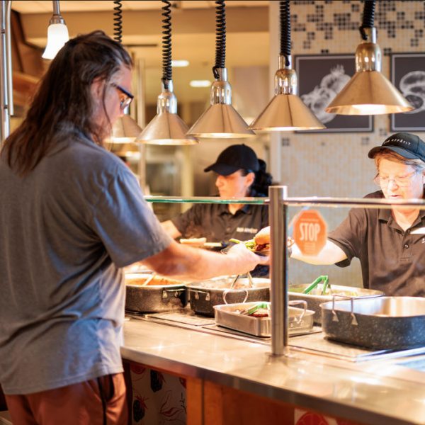 Serving a guest in Stav dining hall