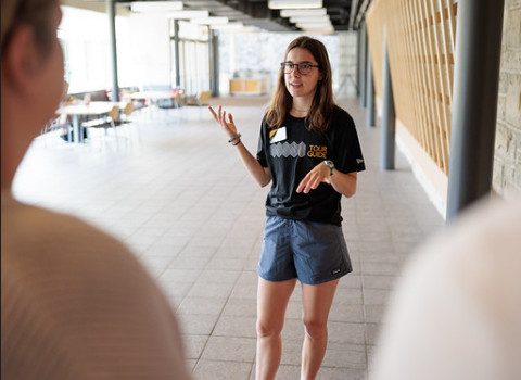 An Admissions tour guide giving a tour