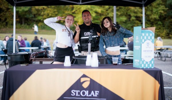 Photo of students and staff at a table marked Public Safety