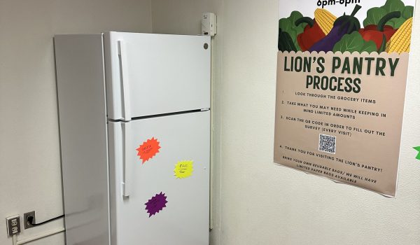 Refrigerator and poster in wall with instructions on how to use the pantry services.