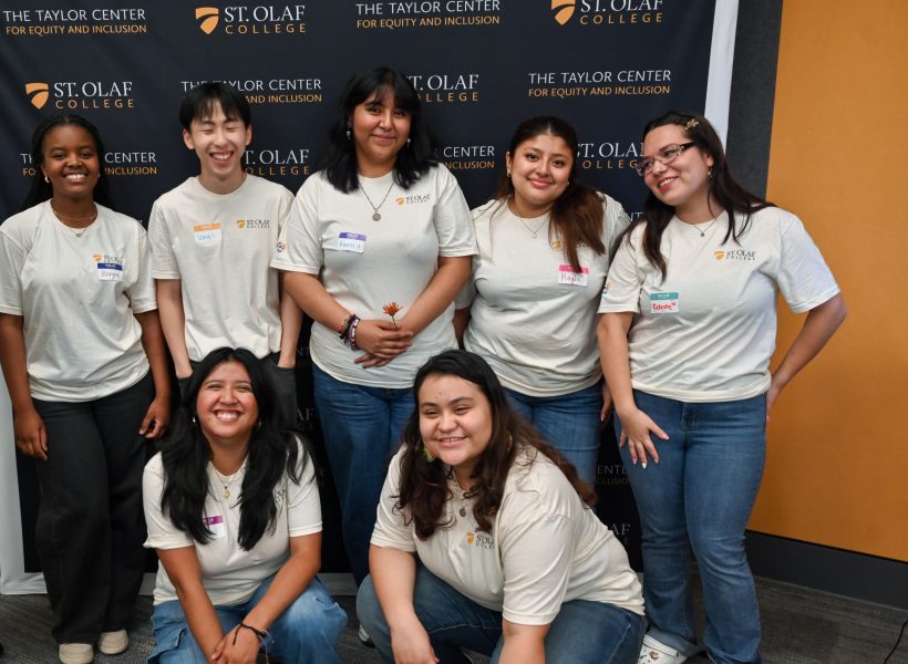 Group of students, 4 standing, 2 kneeling wearing Connect for Suceess t-shirts.