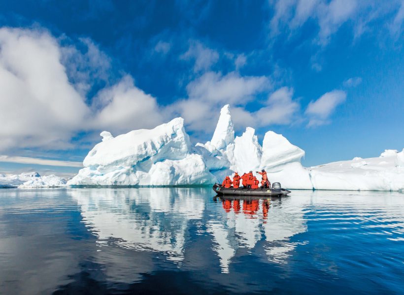 Antarctica Lindblad zodiac in front of iceberg.jpg