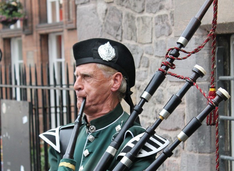 Europe UK United Kingdom Scotland people bagpipes cropped