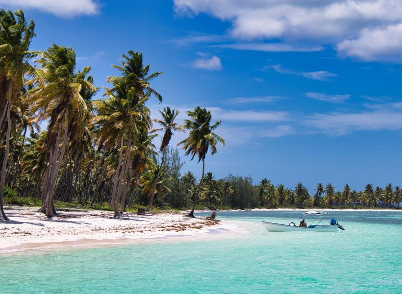 Caribbean palm trees beach boat
