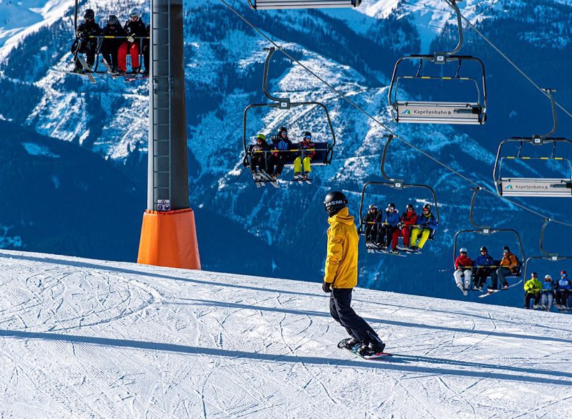 Winter mountains ski lift snowboarder people sports