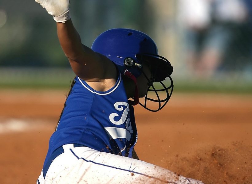 Softball sliding into base people sport